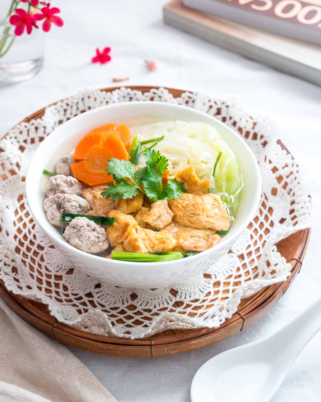 thai omelette soup in a white bowl