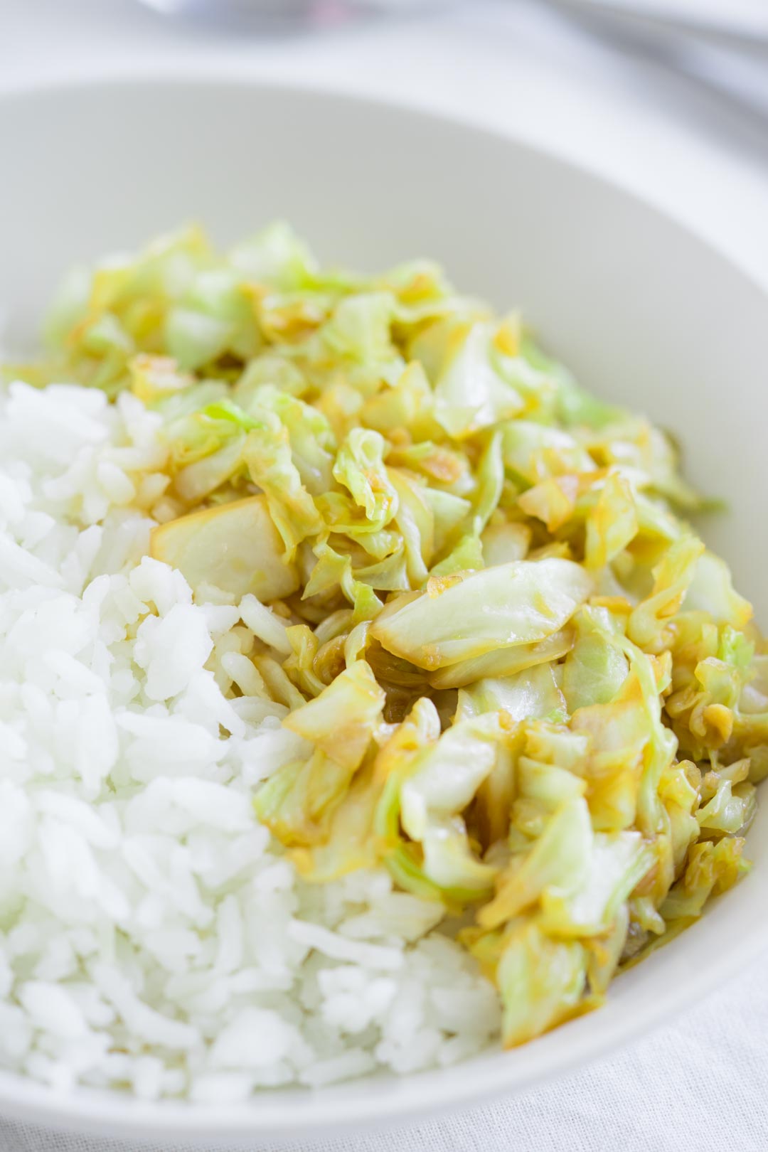 a bowl of rice and cabbage stir-fry