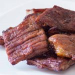 Thai beef jerky or nuea kemon a white plate