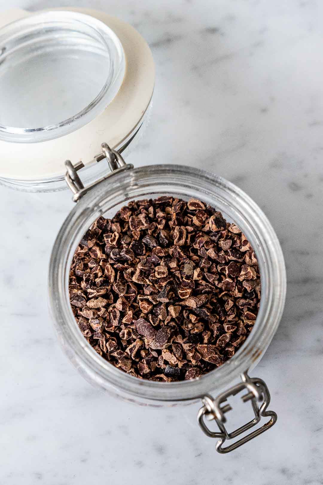raw cacao nibs in a glass jar