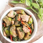 a bowl of thai eggplant stir-fried with salted soy beans and Thai basil