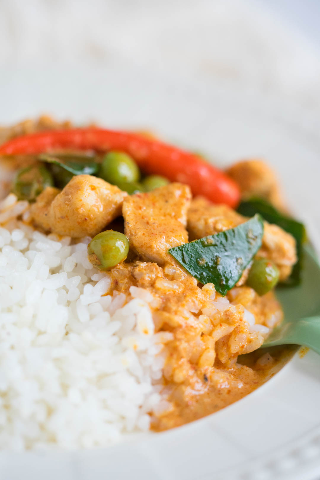 a close up of rice with Thai chicken panang curry