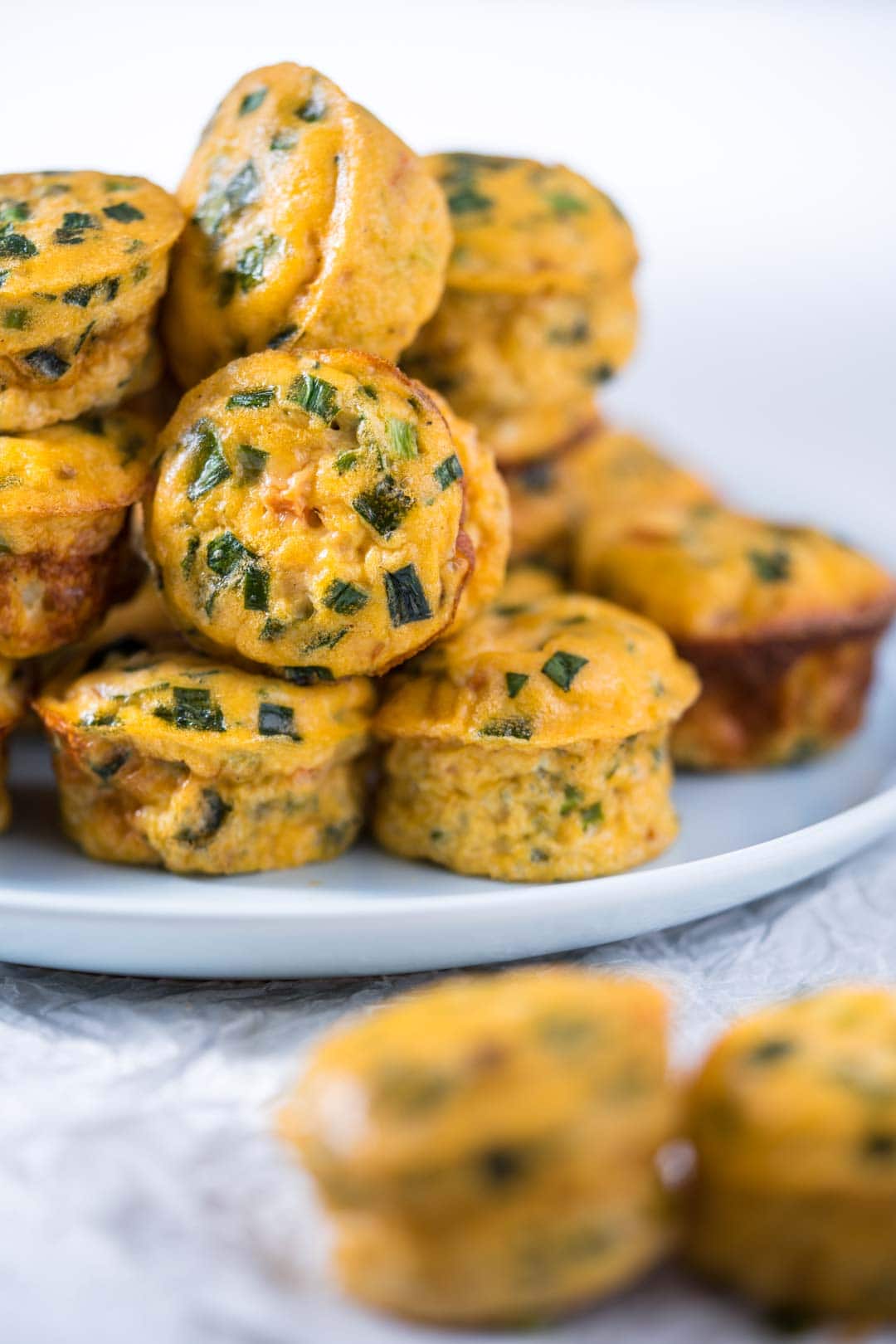 a pile of cottage cheese egg muffins on a blue plate