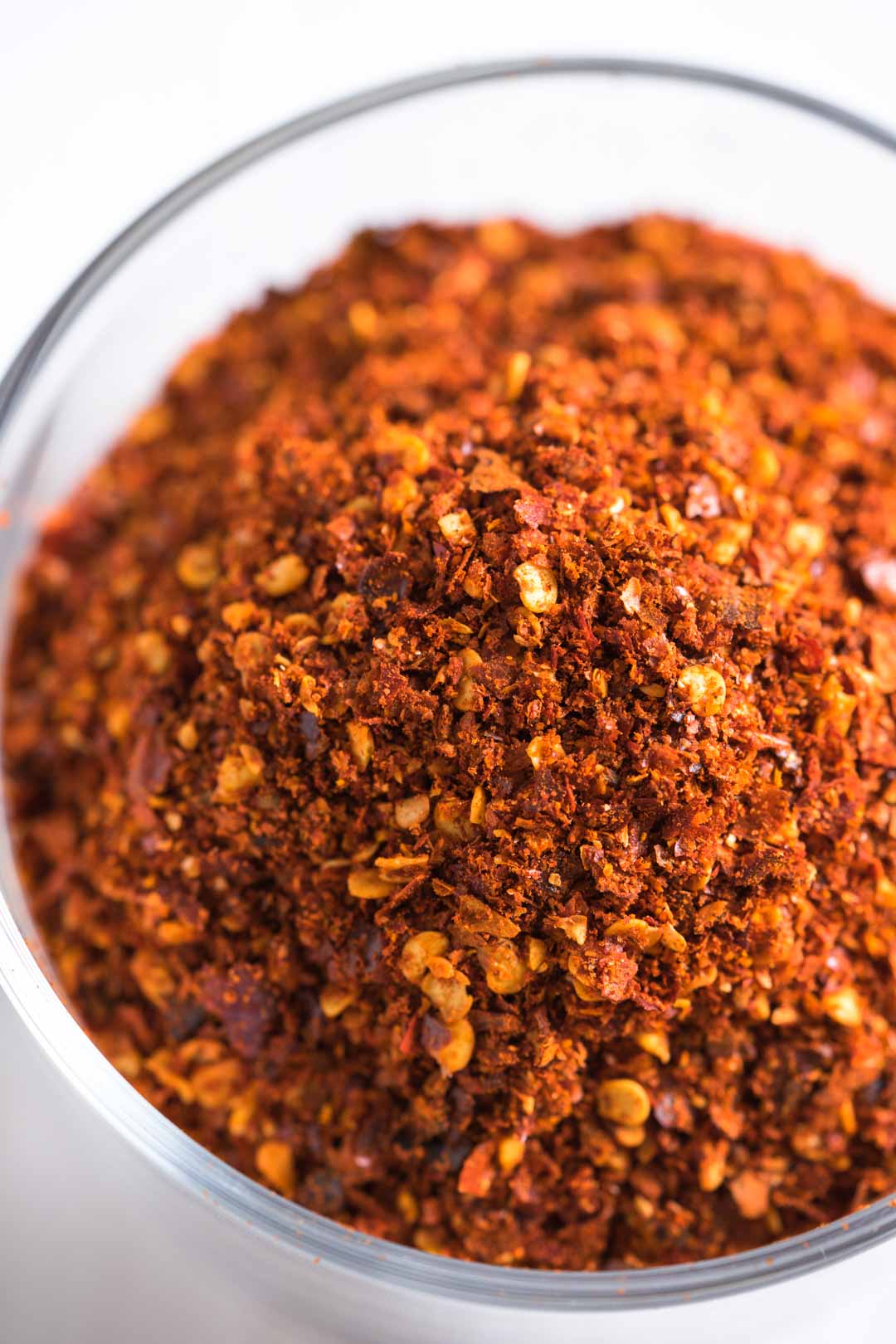 a top view of roasted Thai chili flakes in a cup