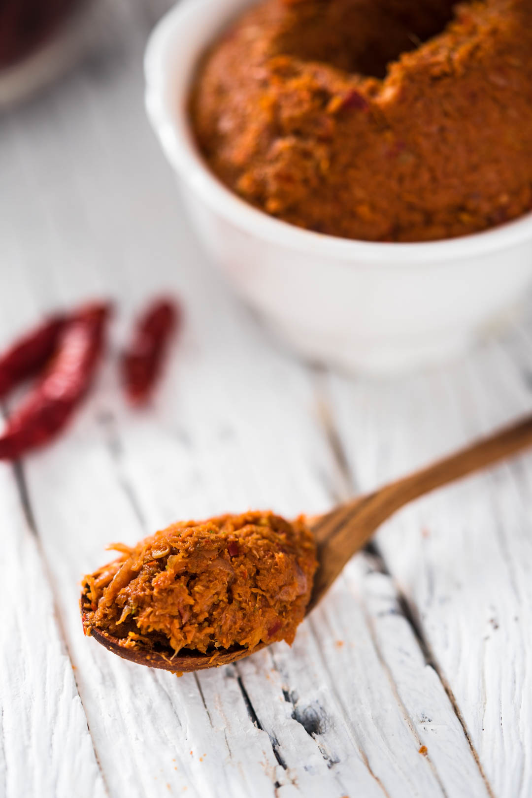 a spoon of Thai red curry paste