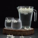 two glasses and a pitcher of jasmine-infused water
