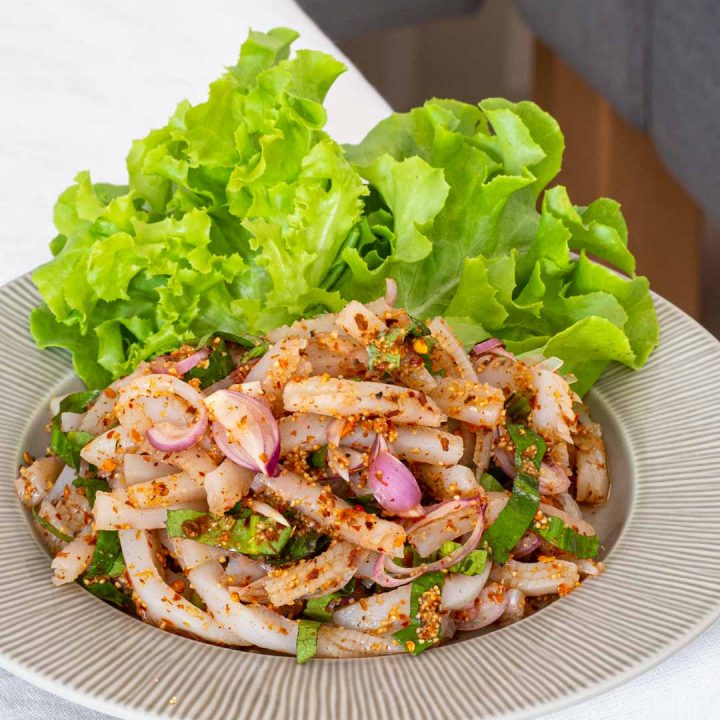 a plate of Thai vegan larb (laab) with konjac noodles on a table