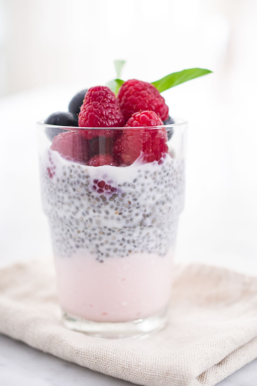 chia pudding with fruit and yogurt in a glass
