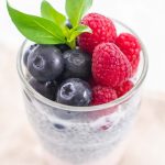chui pudding with strawberry yogurt, blueberries and raspberries in a glass
