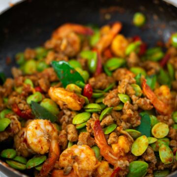 Thai stir fried stink beans with shrimp in a frying pan