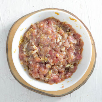 Thai marinated ground pork in a white bowl