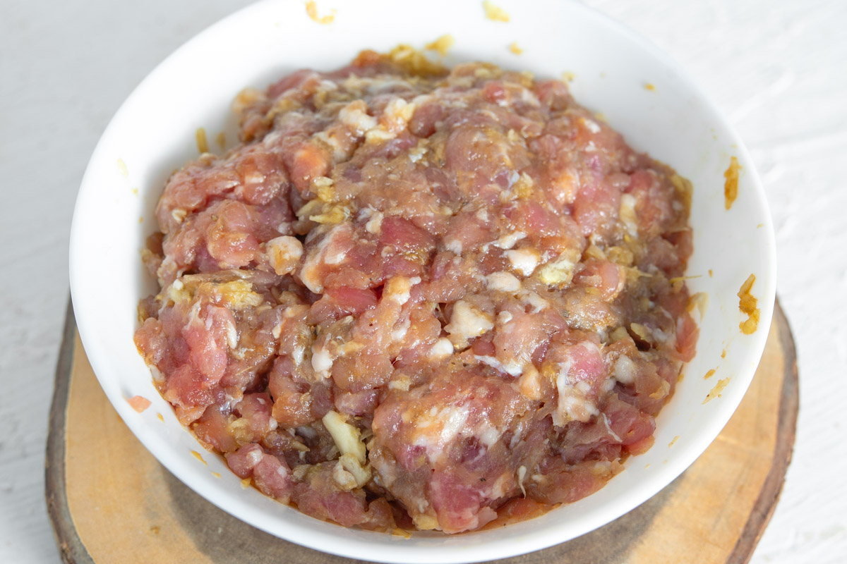 Thai marinated ground pork in a white bowl