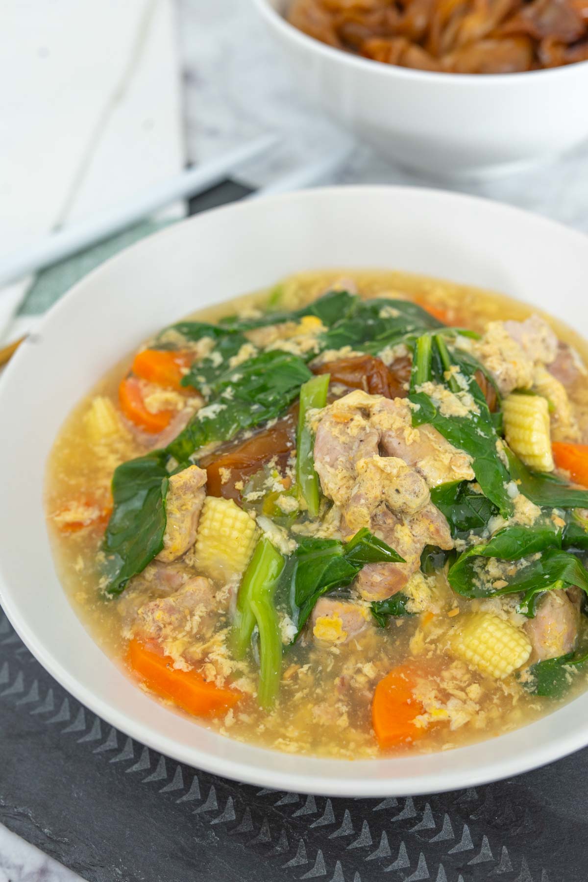 Thai rad na noodles served in a white bowl