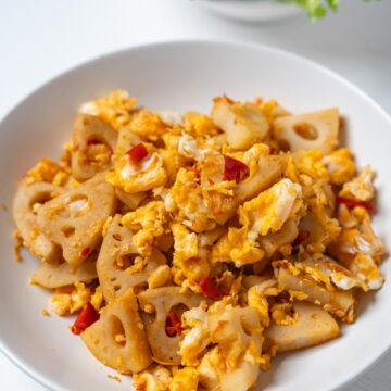 lotus root stir fry in a white dish