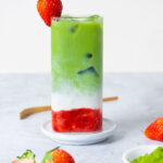 a glass of iced strawberry matcha latte